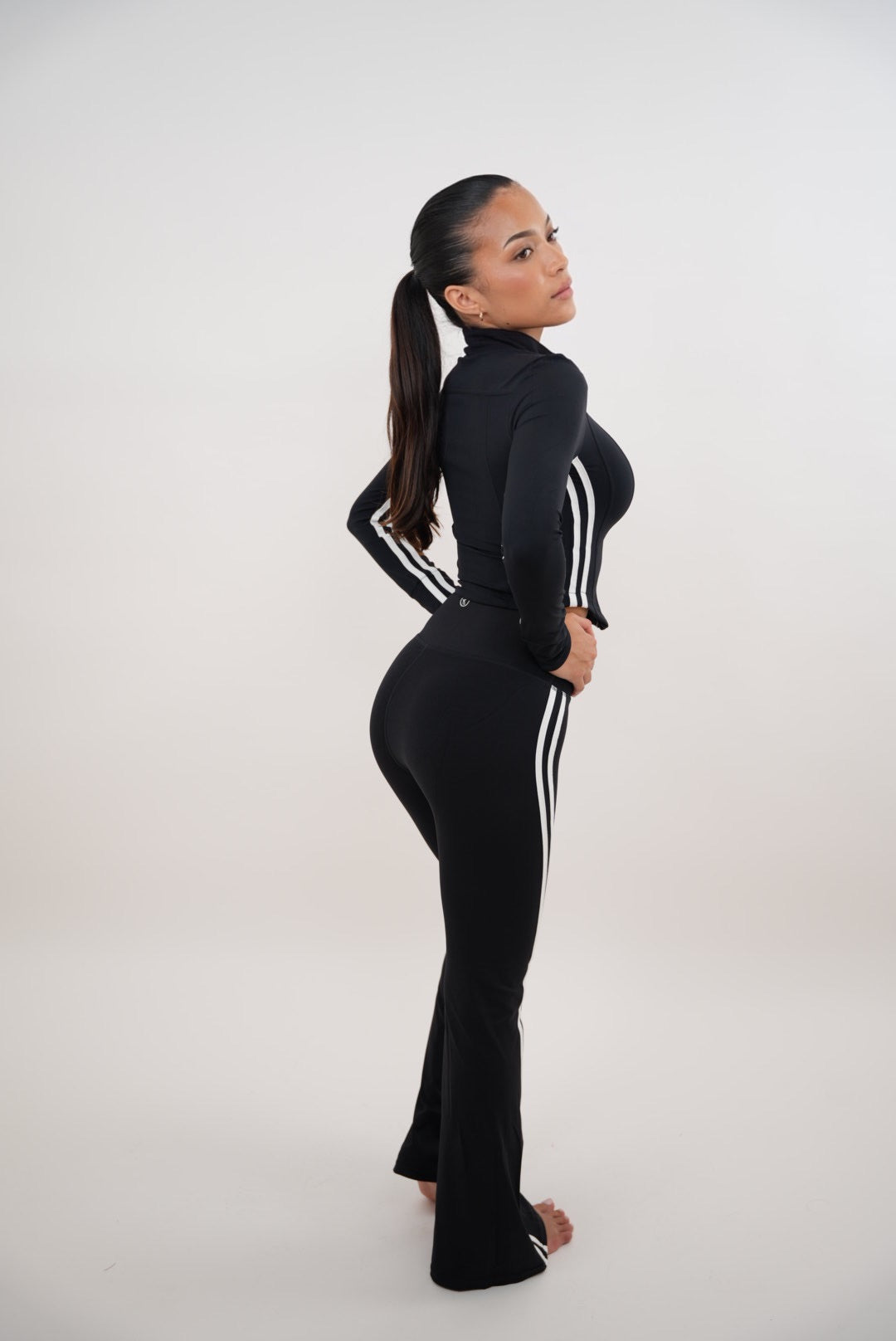 Black flare leggings for women featuring a fitted waistband and flared legs, stylish and comfortable from Plush Fashion Hub.