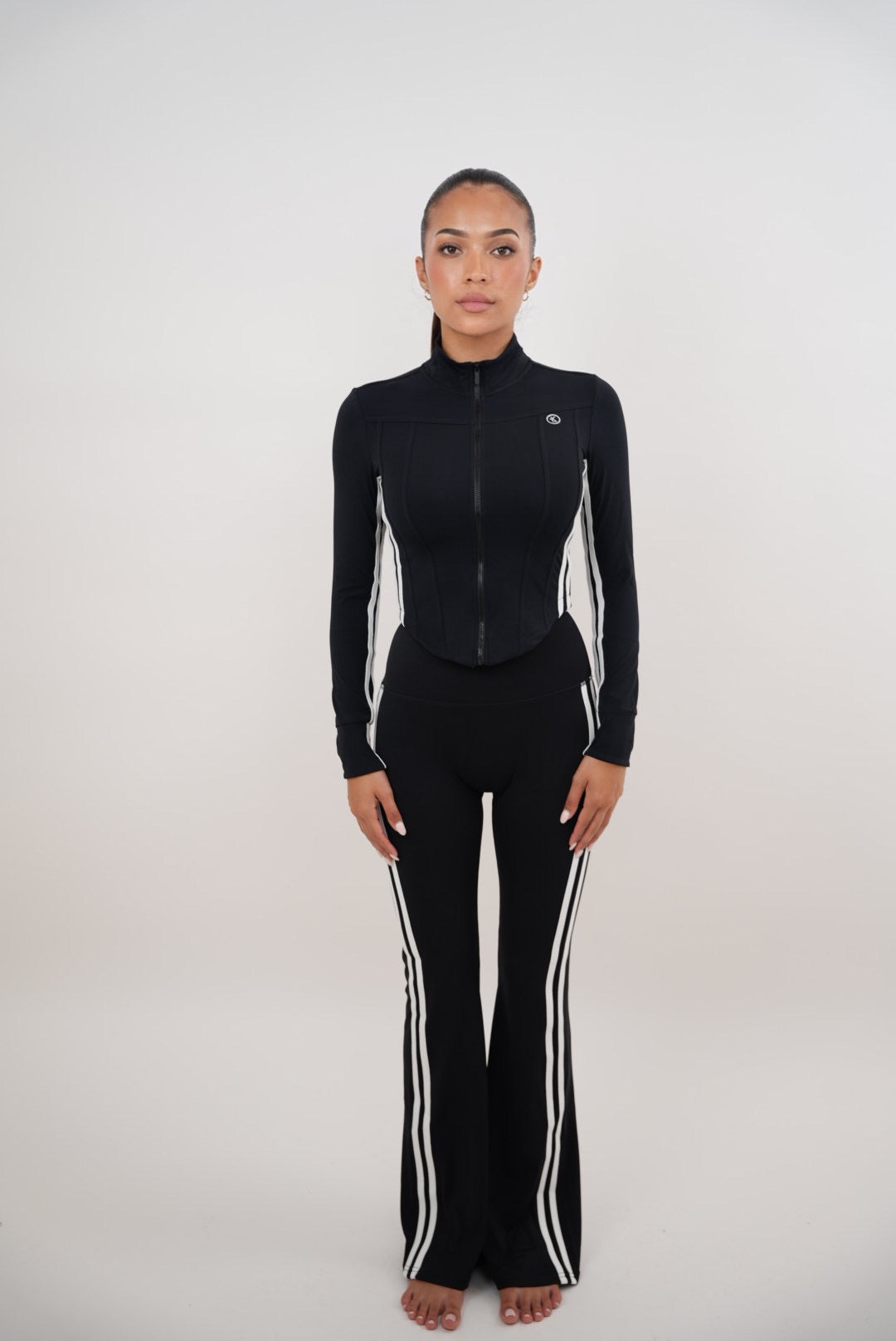 Black flare leggings for women by Plush Fashion Hub, featuring a fitted waist and flared leg design for a stylish, comfortable look.