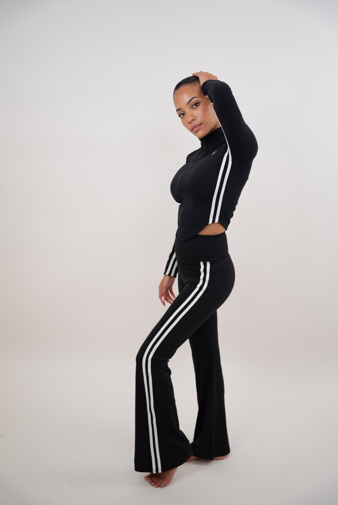 Black flare leggings for motivated women by Plush Fashion Hub, showing a close-up of the stylish, comfortable legging design.