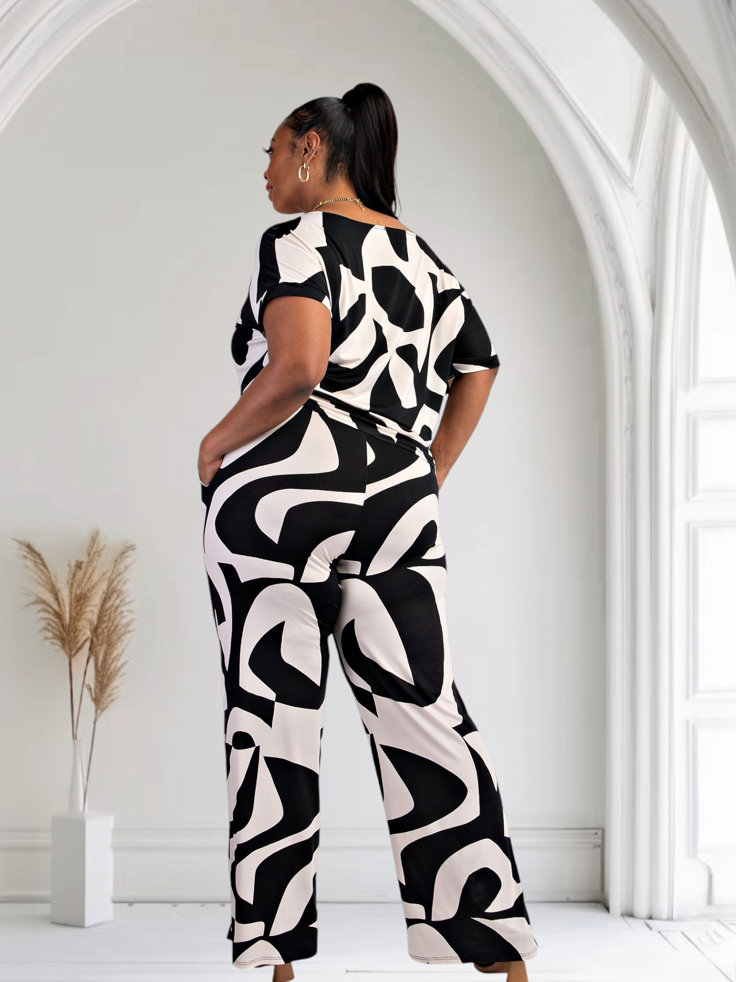 Black and white Lori print matching plus size pants set with pockets by Fasheabe, shown on a model.