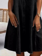 Plus size button-front short sleeve denim dress by Plush Fashion Hub, casual midi style, flattering fit, suitable for everyday wear.