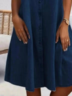 Plus size button-front short sleeve denim dress by Plush Fashion Hub, casual midi style, flattering fit, denim fabric.