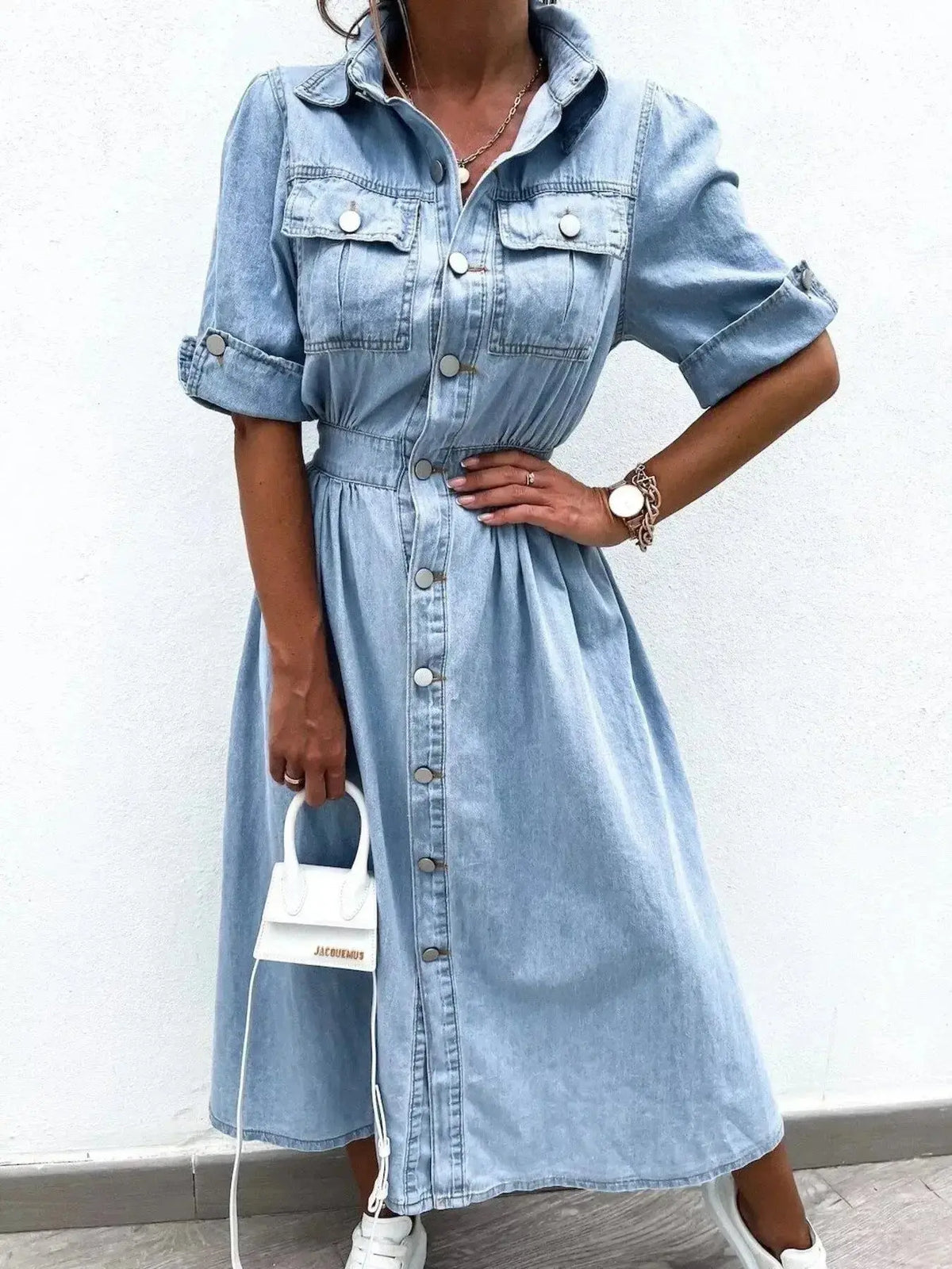 Plus size denim shirt dress by Plush Fashion Hub featuring roll-up sleeves and front pockets, casual and stylish for everyday wear.