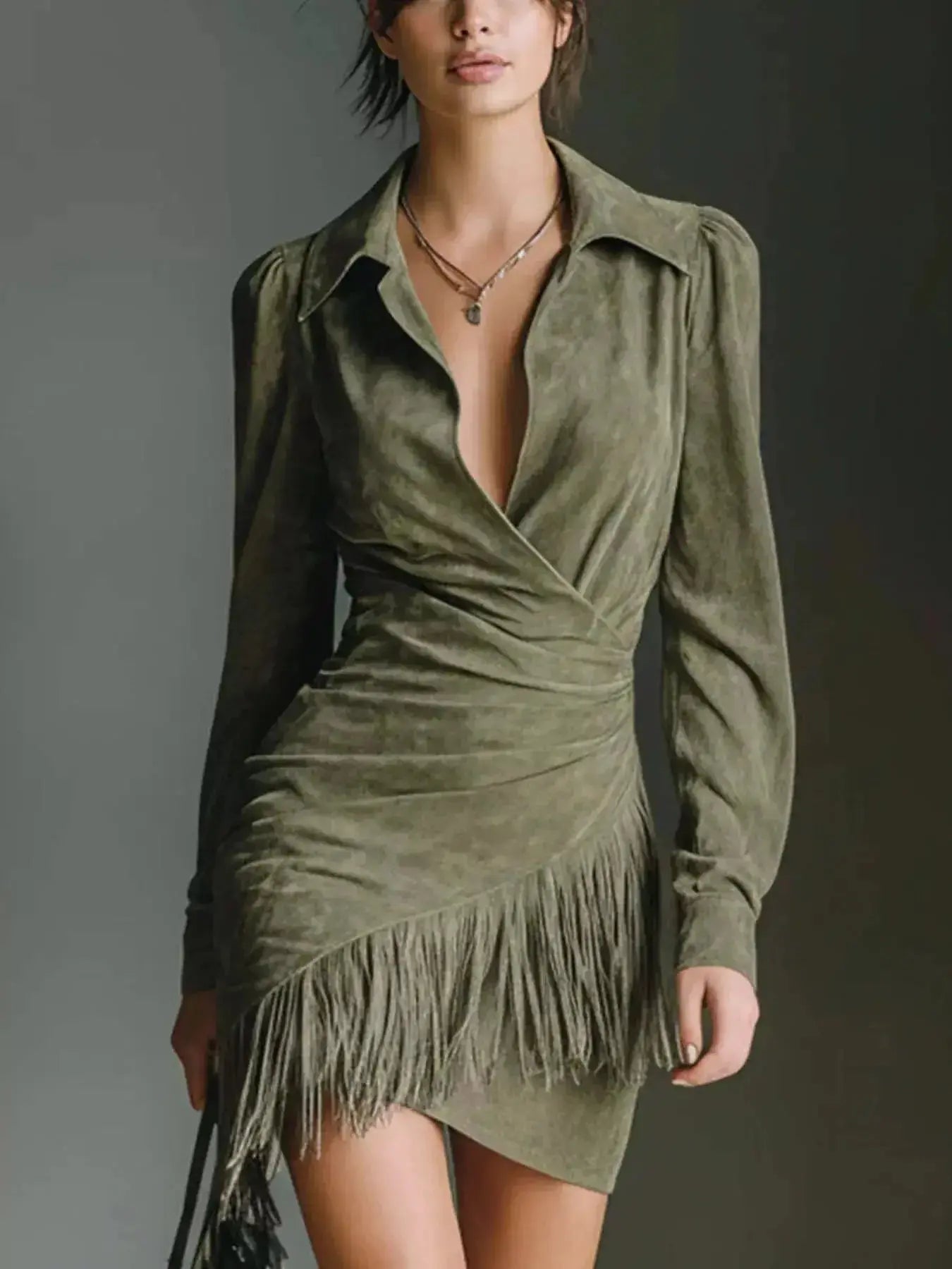 Plus size long sleeve suede boho dress with fringe and bohemian style, featuring a chic shift silhouette from Trendsi.