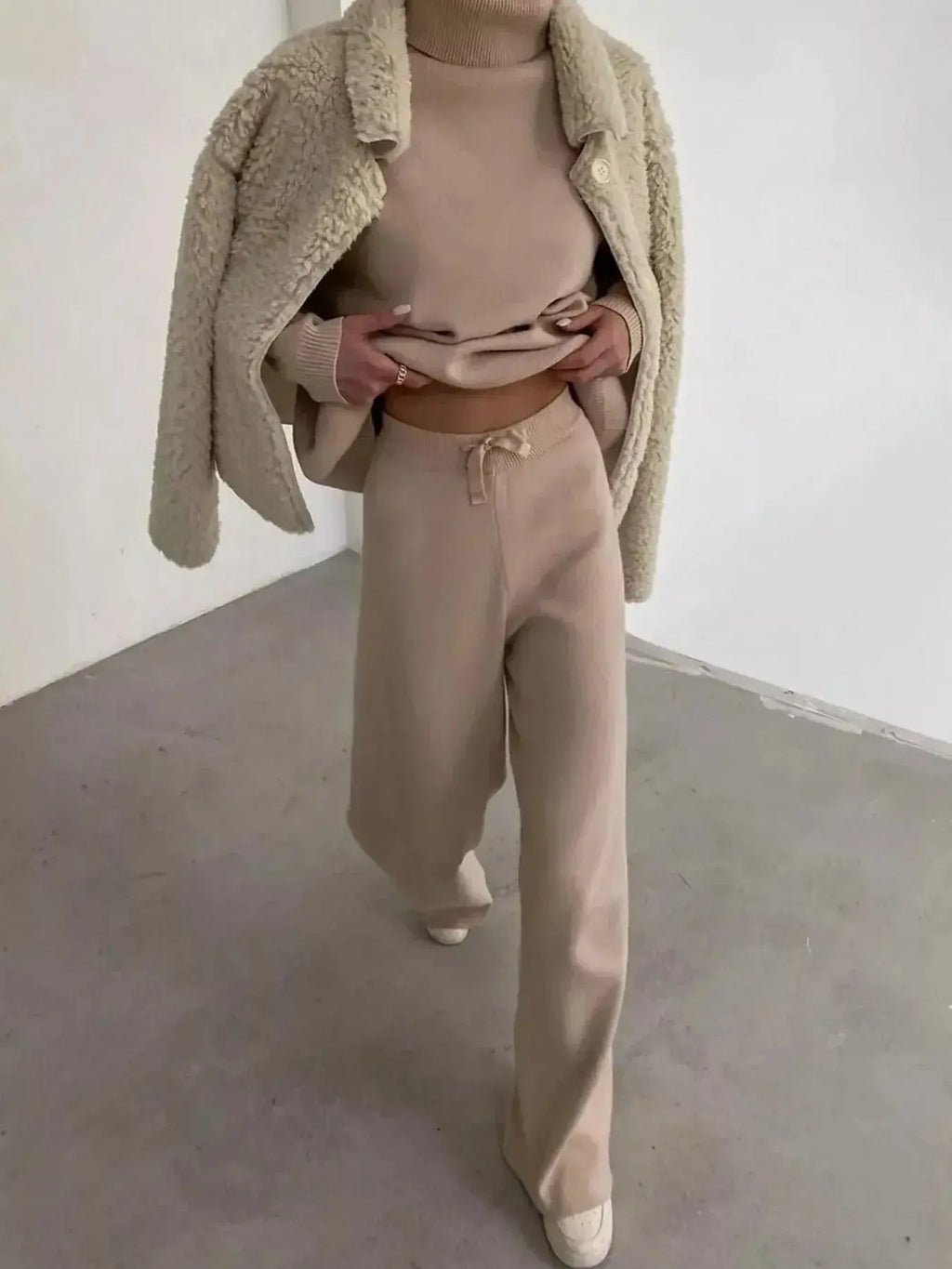 Plus size turtleneck long sleeve sweater and pants two-piece lounge set by Trendsi, comfortable and stylish for relaxed wear.