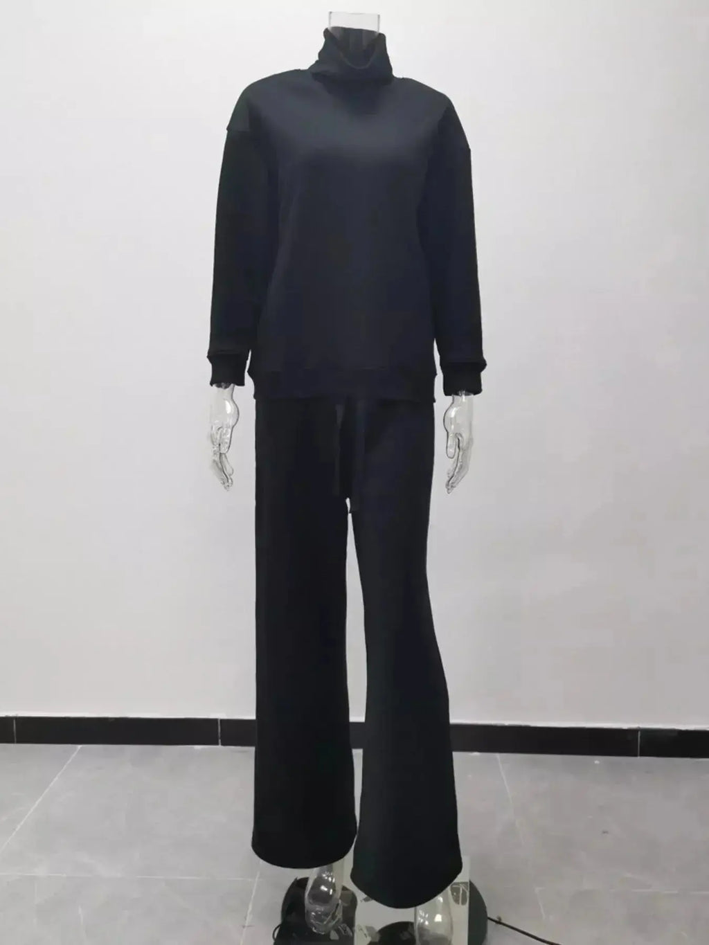 Plus size turtleneck long sleeve sweater and pants lounge set by Trendsi, featuring a cozy two-piece casual wear ensemble.