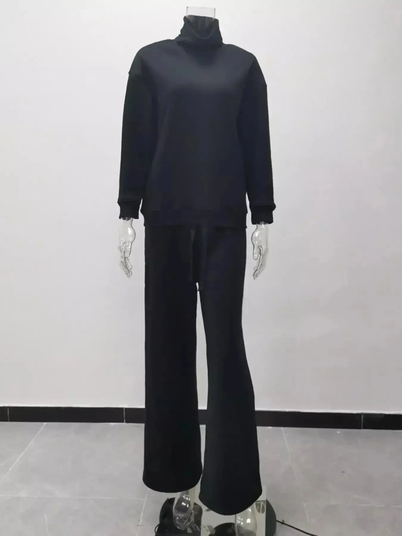 Plus size turtleneck long sleeve sweater and pants lounge set by Trendsi, featuring a cozy two-piece casual wear ensemble.