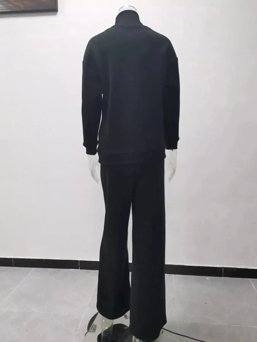Plus size turtleneck long sleeve sweater and matching pants two-piece lounge set by Trendsi, cozy and stylish for casual wear.