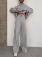 Plus size turtleneck long sleeve sweater and matching pants lounge set by Trendsi, comfortable two-piece casual outfit.