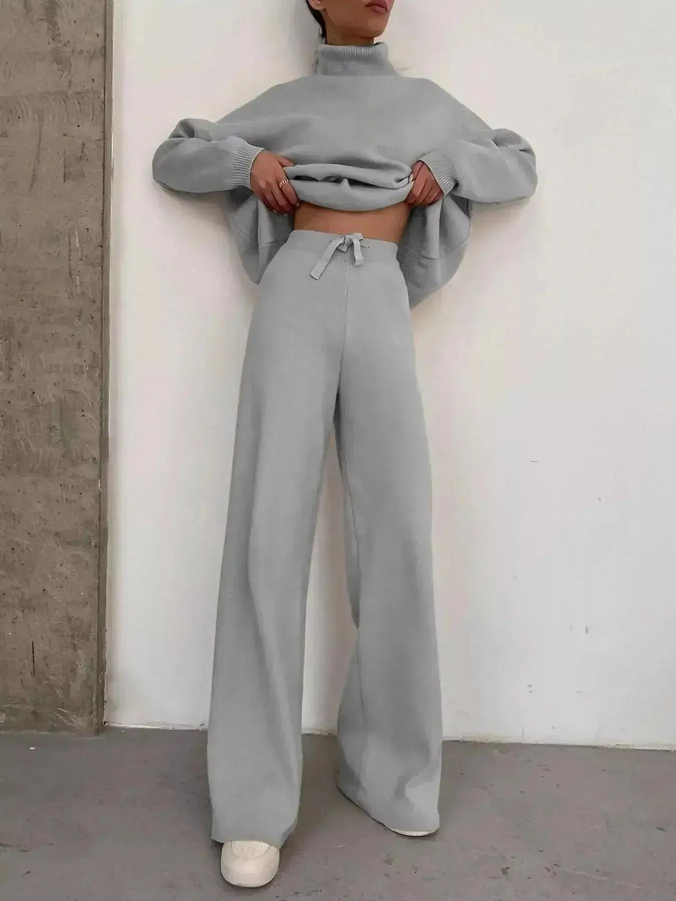 Plus size turtleneck long sleeve sweater and matching pants lounge set by Trendsi, comfortable two-piece casual outfit.