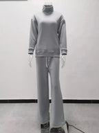 Plus size turtleneck long sleeve sweater and pants two-piece lounge set by Trendsi, comfortable casual outfit for relaxed wear.
