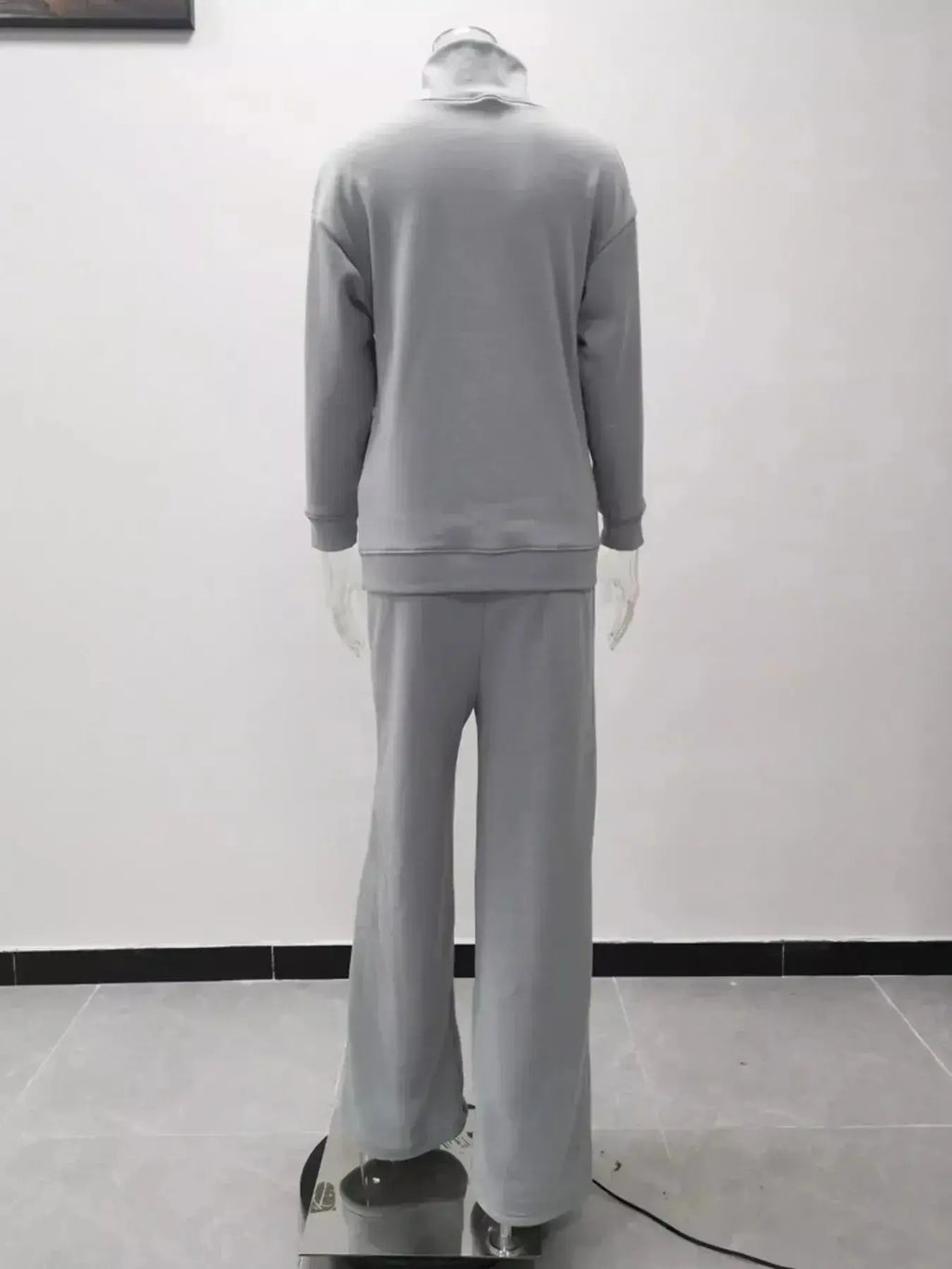 Plus size turtleneck long sleeve sweater and pants lounge set by Trendsi, cozy two-piece outfit for comfortable wear.