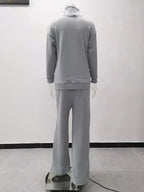 Plus size turtleneck long sleeve sweater and pants lounge set by Trendsi, cozy two-piece outfit for comfortable wear.