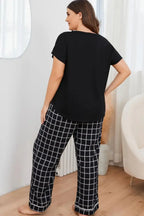 Plus size V-neck top and plaid lounge pants 2-piece set by Plush Fashion Hub, featuring comfortable, stylish casual wear.