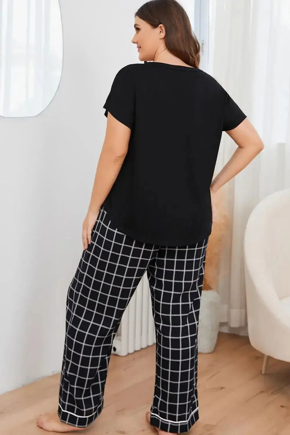 Plus size V-neck top and plaid lounge pants 2-piece set by Plush Fashion Hub, featuring comfortable, stylish casual wear.