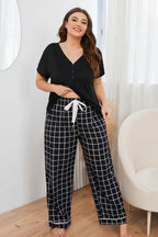 Plus size V-neck top and plaid lounge pants 2-piece set by Plush Fashion Hub, comfortable casual wear for relaxed moments.