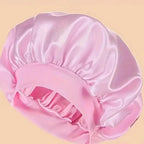 Plush Fashion Hub premium satin sleep bonnet with wide comfort band, designed for hair protection during sleep.