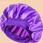 Plush Fashion Hub premium satin sleep bonnet with wide comfort band, designed for hair protection during sleep.