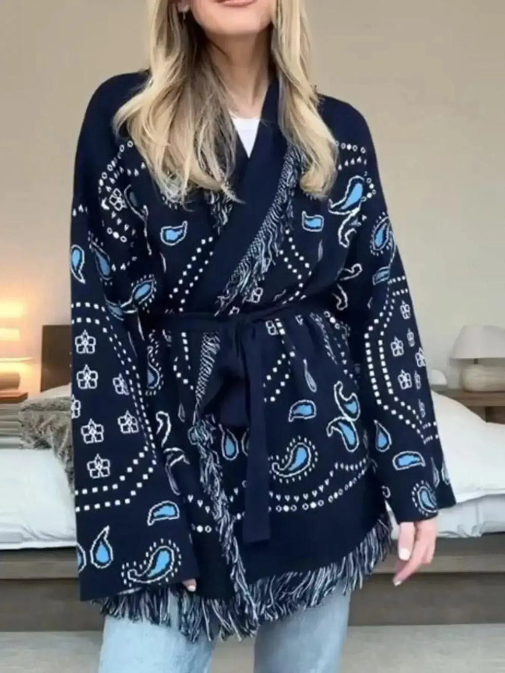 Bohemian printed fringe knit cardigan with long sleeves and tie front from Plush Fashion Hub, perfect for layered boho style.