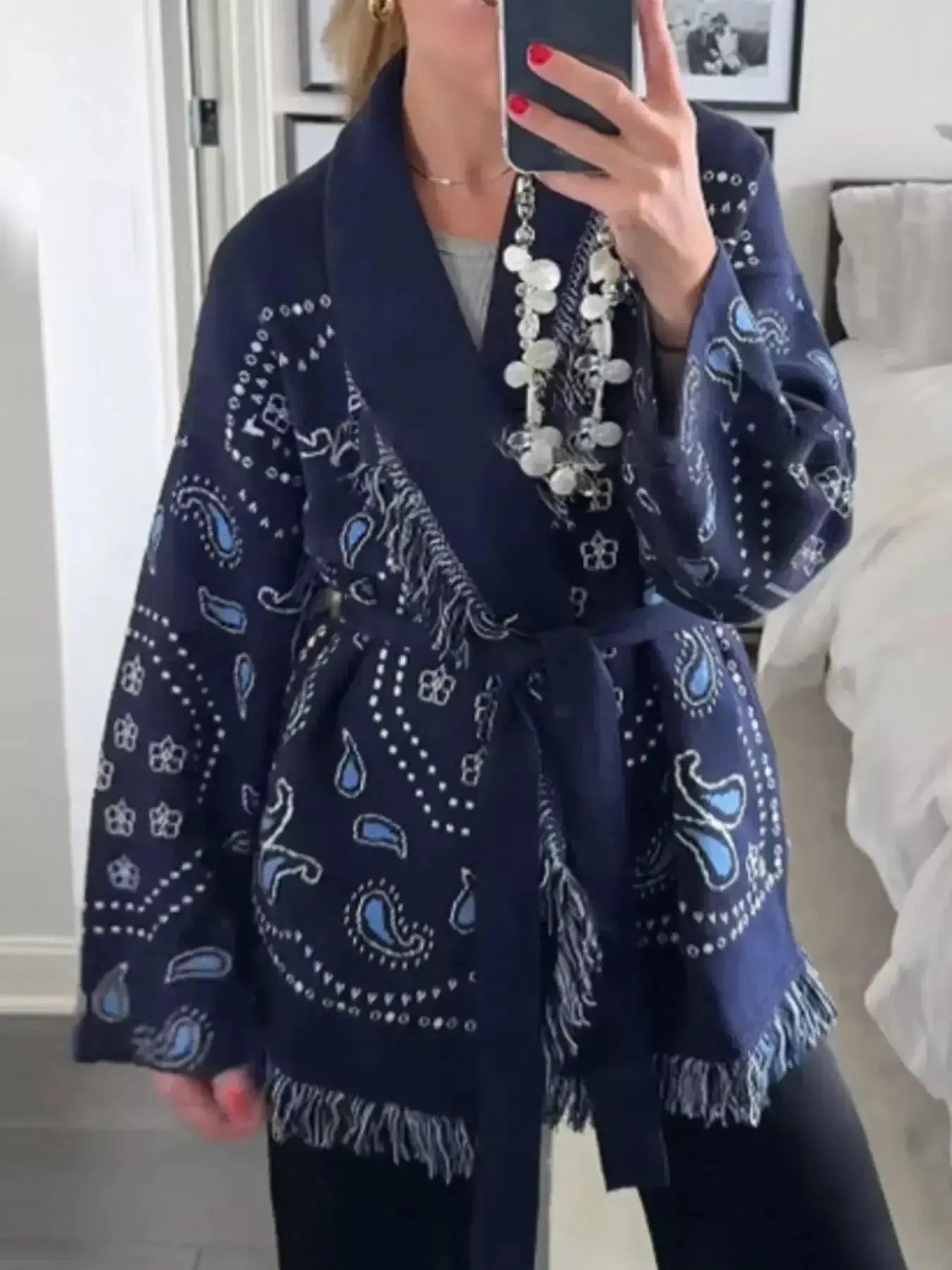 Bohemian printed fringe knit cardigan with long sleeves and tie front from Plush Fashion Hub, layered and perfect for casual wear.
