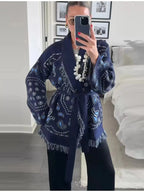 Bohemian printed fringe knit cardigan with long sleeves and tie front, stylish layered top by Plush Fashion Hub.
