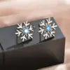 Sterling silver flower stud earrings from Plush Fashion Hub, showcasing intricate floral design and versatile style.