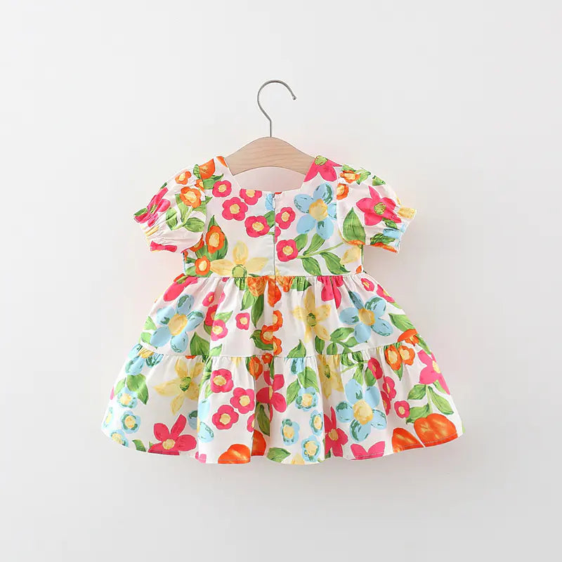 Girls' floral dress with matching bag from Trendy Attic Store01, featuring colorful flower patterns and a comfortable fit.
