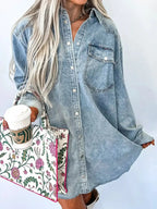 Raw hem denim button-down shirt dress with pockets, relaxed cotton fit, worn casually by a model, by Trendsi.