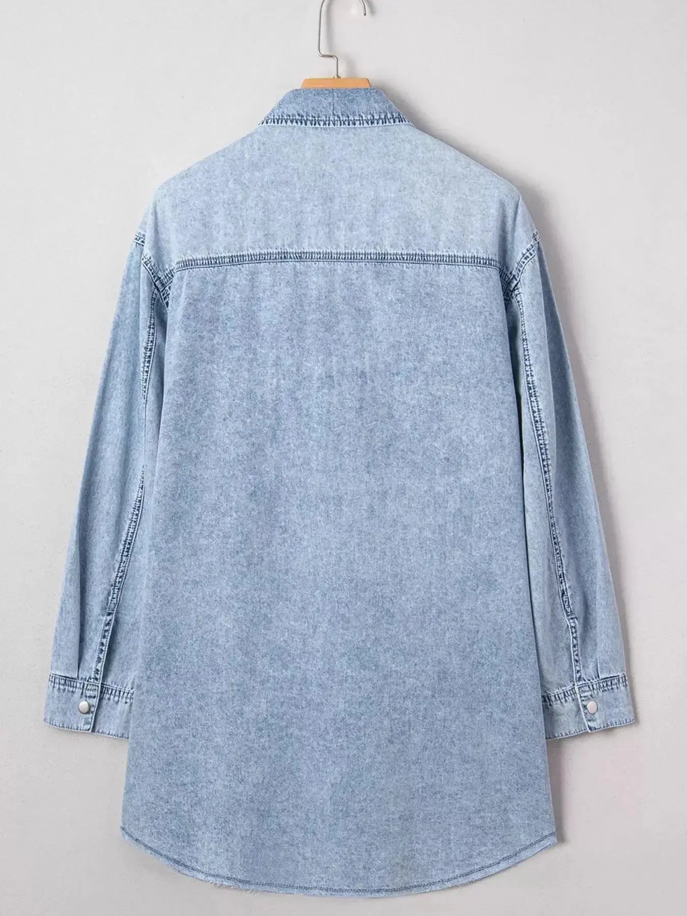 Raw hem denim button-down shirt dress with pockets, relaxed cotton fit, casual style, by Trendsi.