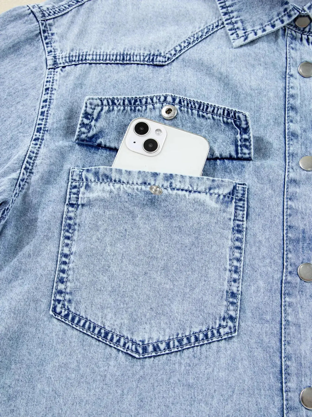 Raw hem denim button-down shirt dress with pockets, relaxed cotton fit, featuring a classic denim style and casual look.