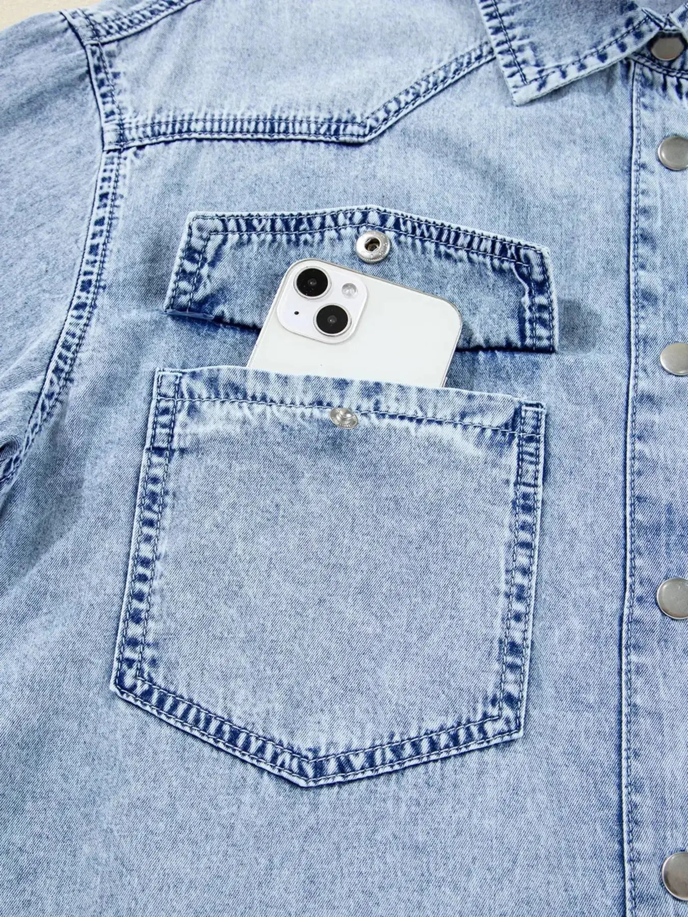 Raw hem denim button-down shirt dress with pockets, relaxed cotton fit, featuring a classic denim style and casual look.