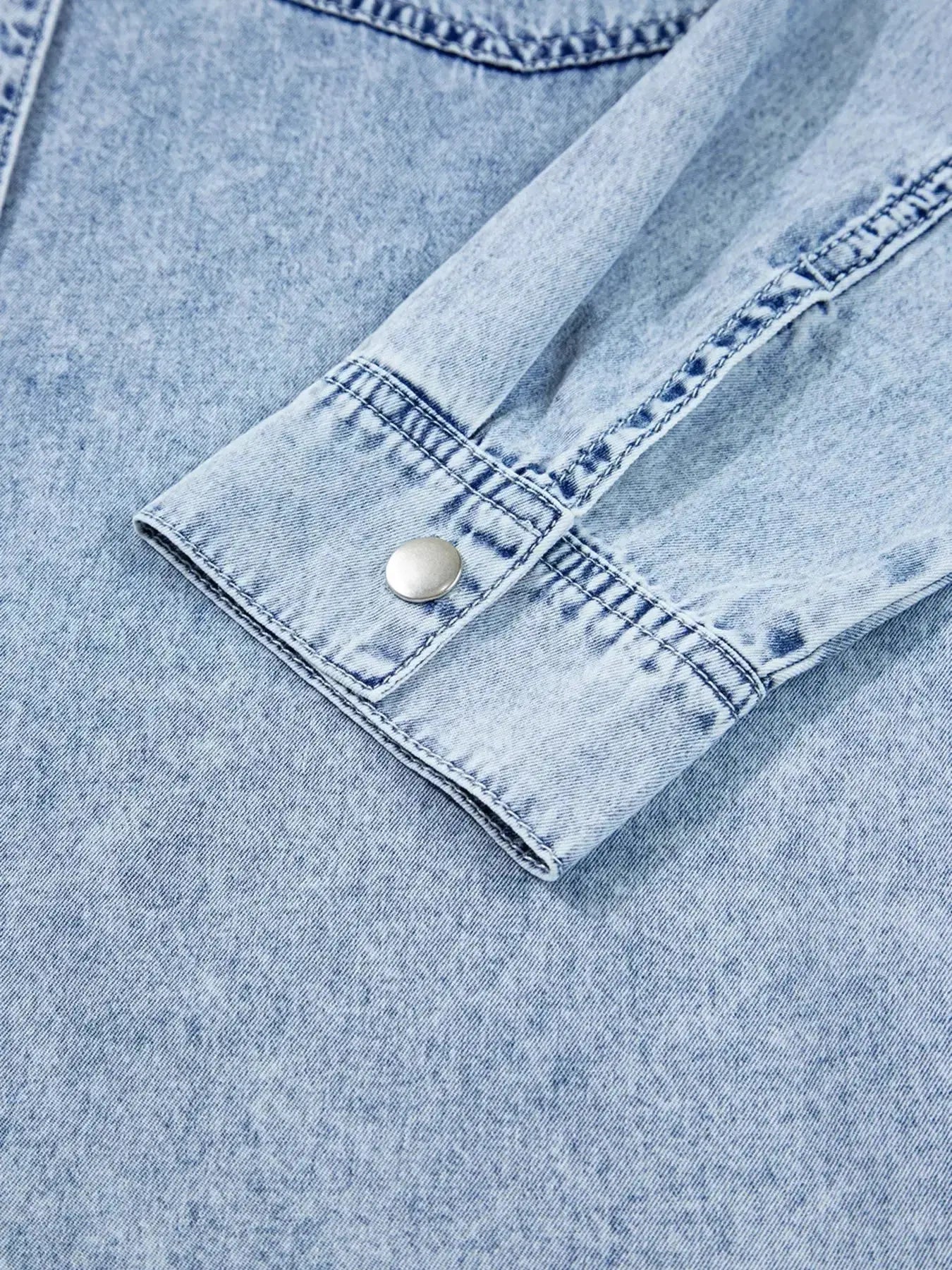 Raw hem denim button-down shirt dress with pockets, relaxed cotton fit, shown in classic blue denim fabric by Trendsi.