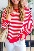 Red striped drop shoulder long sleeve top with exposed seams from Gilded Glamour Shop, showcasing a casual and stylish design.