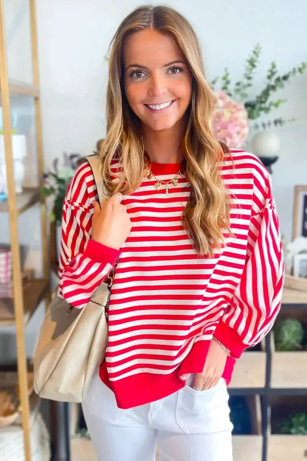Red striped long sleeve top with drop shoulders and exposed seams, stylishly designed by Gilded Glamour Shop.