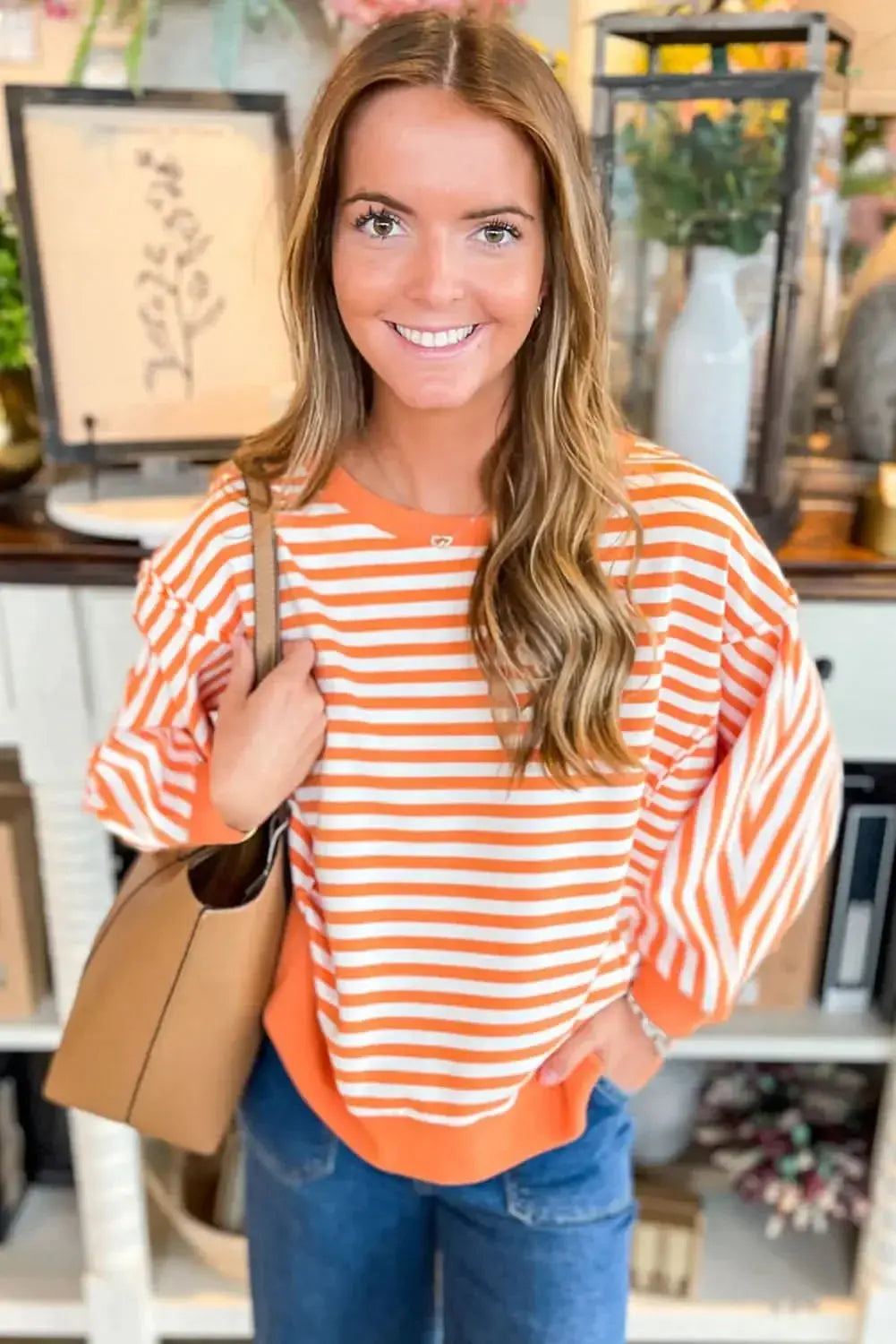 Red striped drop shoulder long sleeve top with exposed seams from Gilded Glamour Shop, featuring a relaxed fit and casual style.