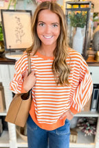 Red striped drop shoulder long sleeve top with exposed seams from Gilded Glamour Shop, featuring a relaxed fit and casual style.