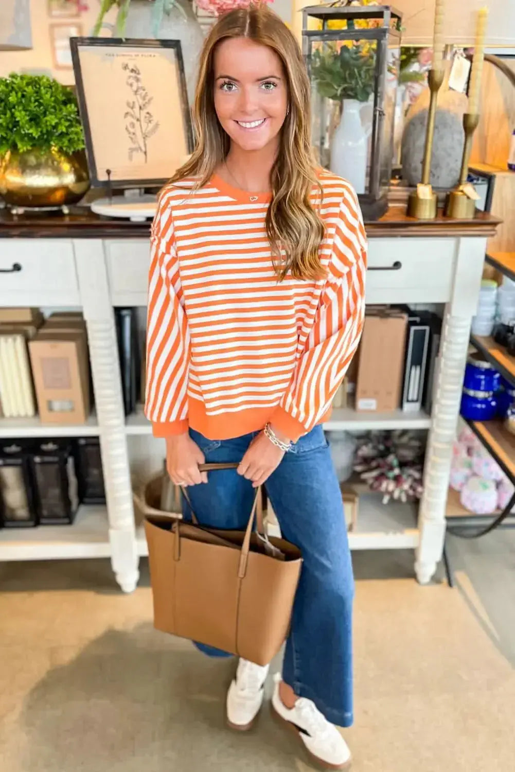 Red striped drop shoulder long sleeve top with exposed seams, from Gilded Glamour Shop, featuring casual, stylish design.