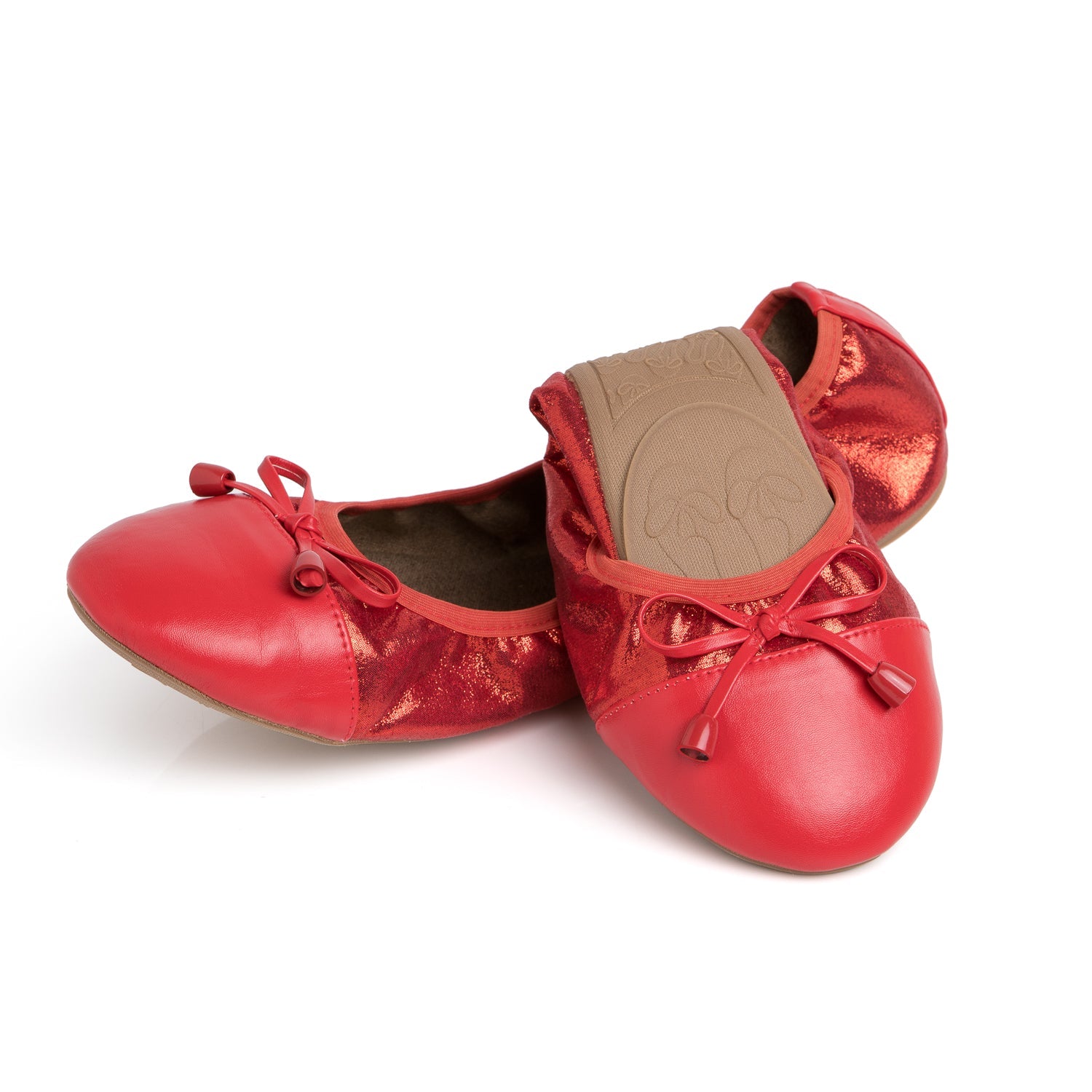 Red Talaria Flats shoes in a ruby red color with a half-folded design, showcasing comfortable, stylish footwear.