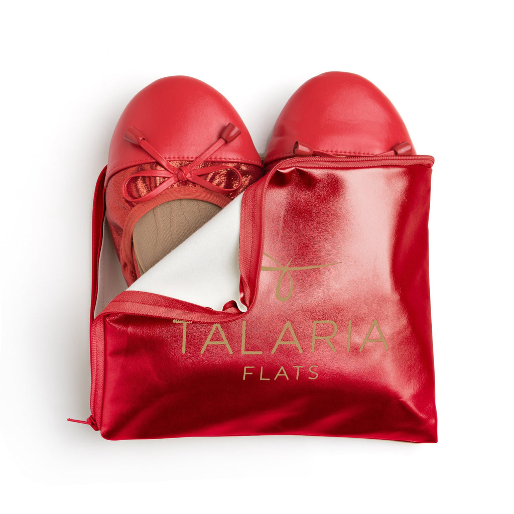 Talaria Flats premium ruby red flats shoes inside a storage bag, showcasing stylish and comfortable footwear.
