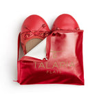 Talaria Flats premium ruby red flats shoes inside a storage bag, showcasing stylish and comfortable footwear.