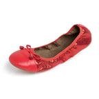 Red Talaria Flats shoes in ruby red with a sleek, pointed toe design, perfect for casual or dressy outfits.