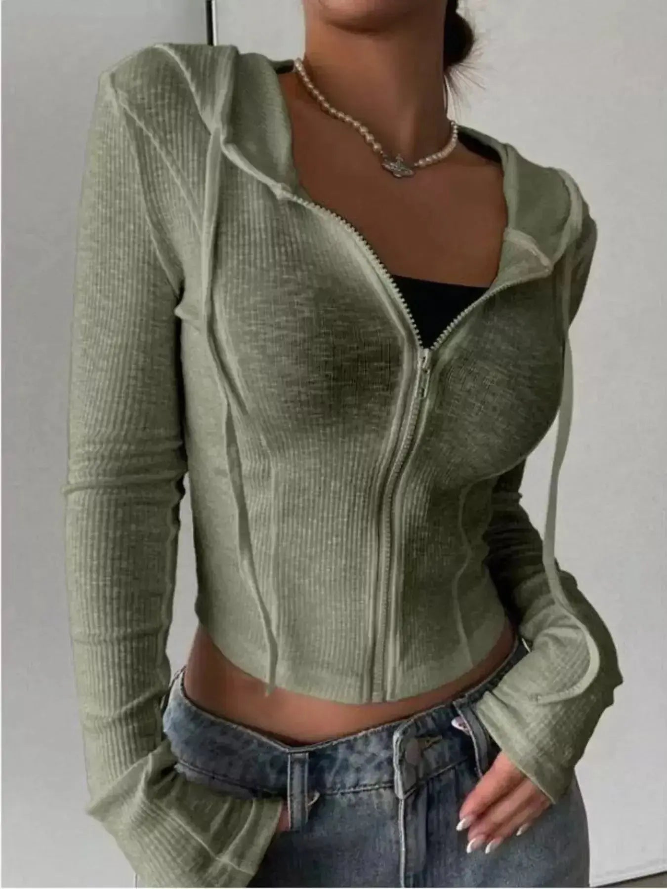 Women's ribbed knit cropped zip-up jacket with hood from Plush Fashion Hub, featuring a cozy, fitted outerwear design.