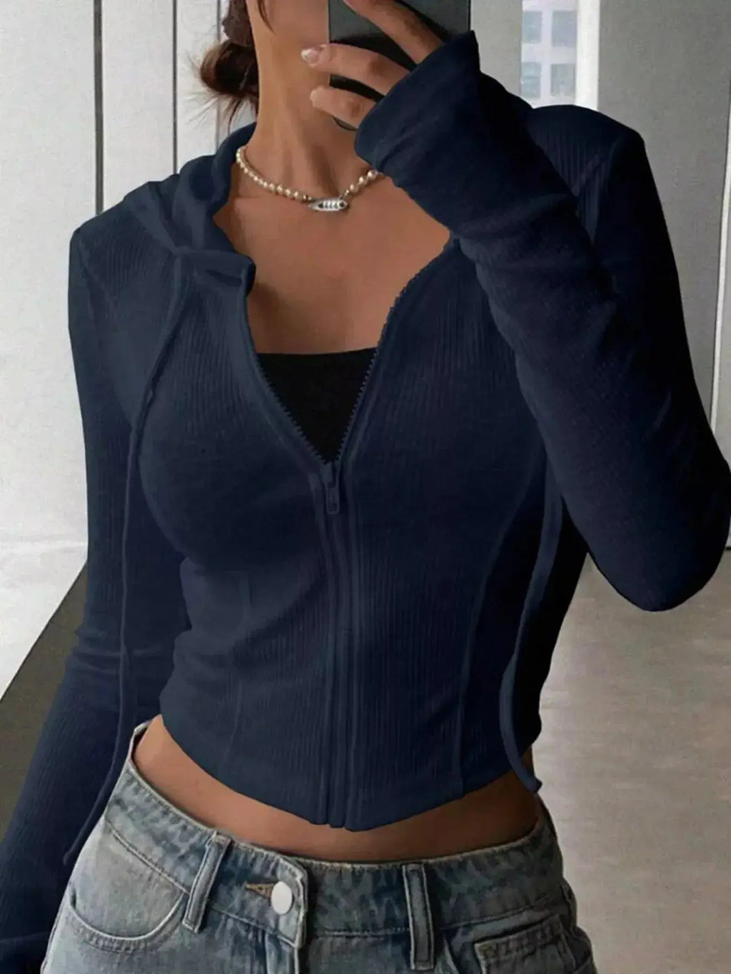 Women's ribbed knit cropped zip-up hoodie jacket by Plush Fashion Hub, featuring a hood and textured knit design.