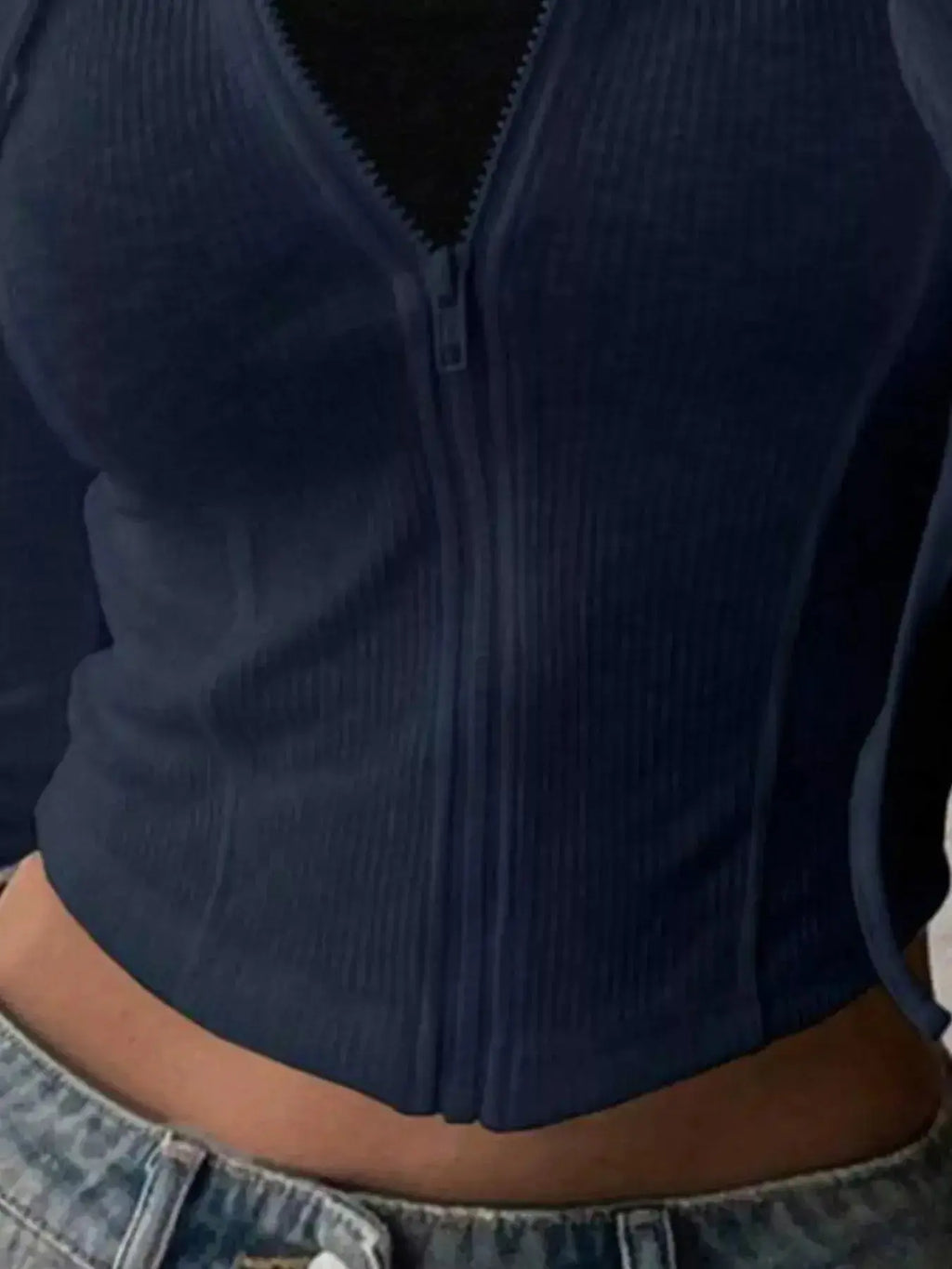 Women's ribbed knit cropped zip-up hoodie jacket by Plush Fashion Hub, featuring a hood and fitted ribbed design.