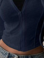 Women's ribbed knit cropped zip-up hoodie jacket by Plush Fashion Hub, featuring a hood and fitted ribbed design.