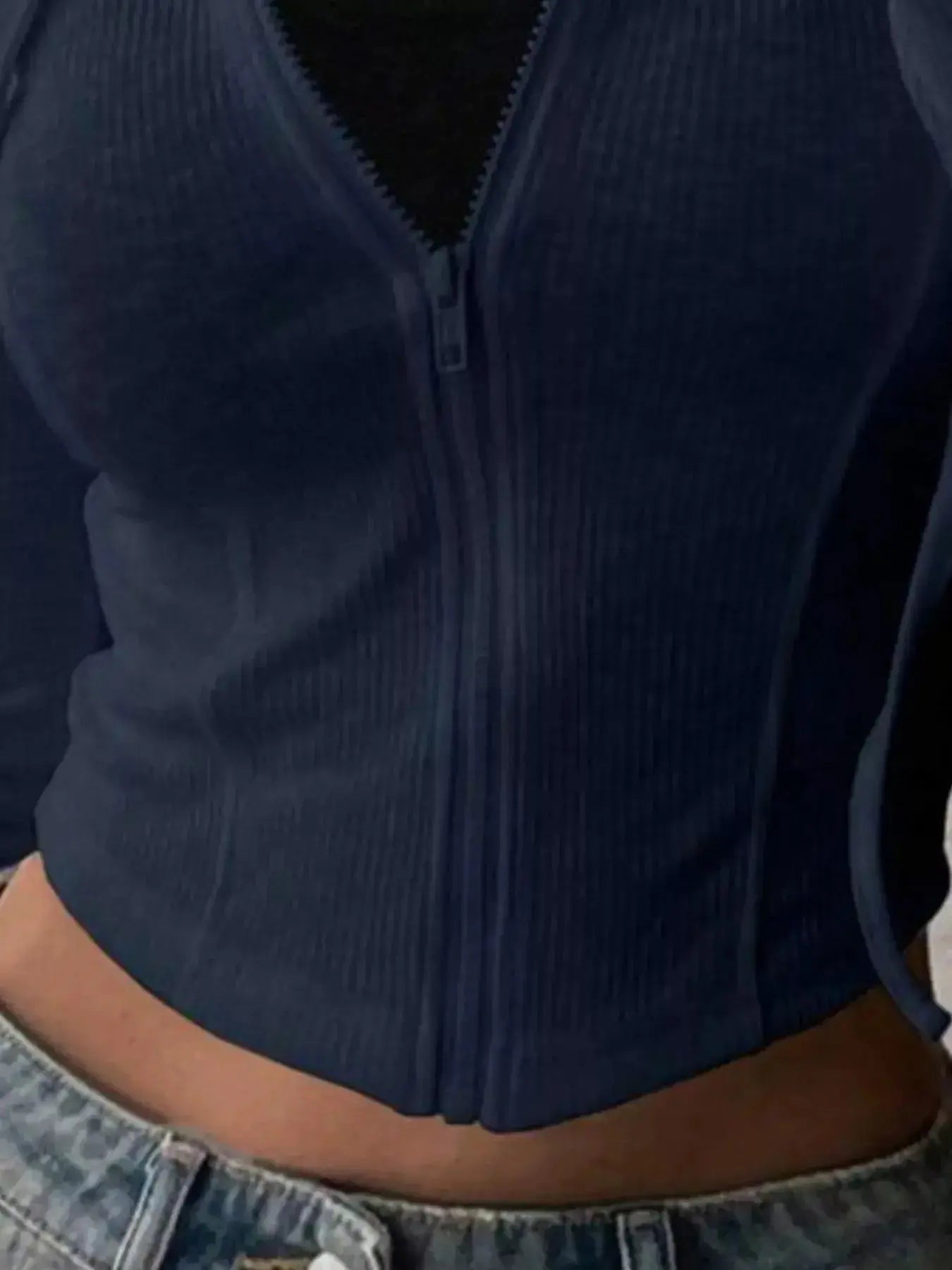 Women's ribbed knit cropped zip-up hoodie jacket by Plush Fashion Hub, featuring a hood and fitted ribbed design.