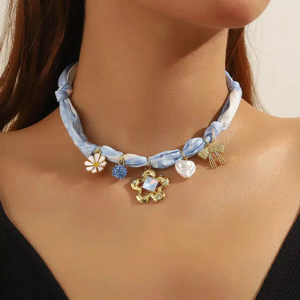 Elegant ribbon flower charm necklace with floral pendant for women, featuring a stylish design by Plush Fashion Hub.