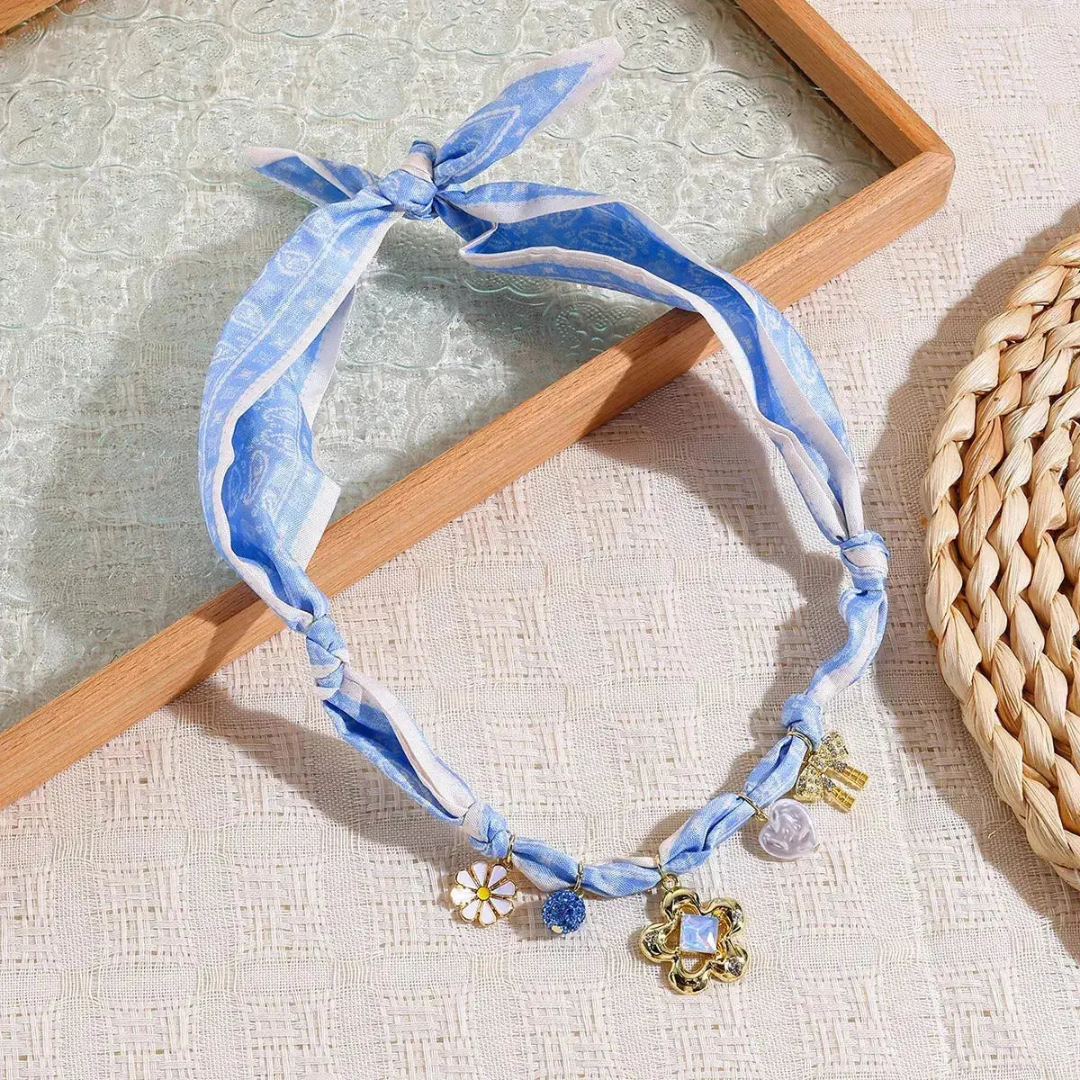 Elegant floral pendant necklace with ribbon flower charm, designed for women by Plush Fashion Hub.