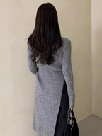 Round neck irregular slit knit dress by Plush Fashion Hub, showcasing a stylish design with unique slit details.