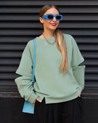 Women's graphic printed loose fit round neck sweatshirt from Plush Fashion Hub, soft casual pullover with a stylish design.